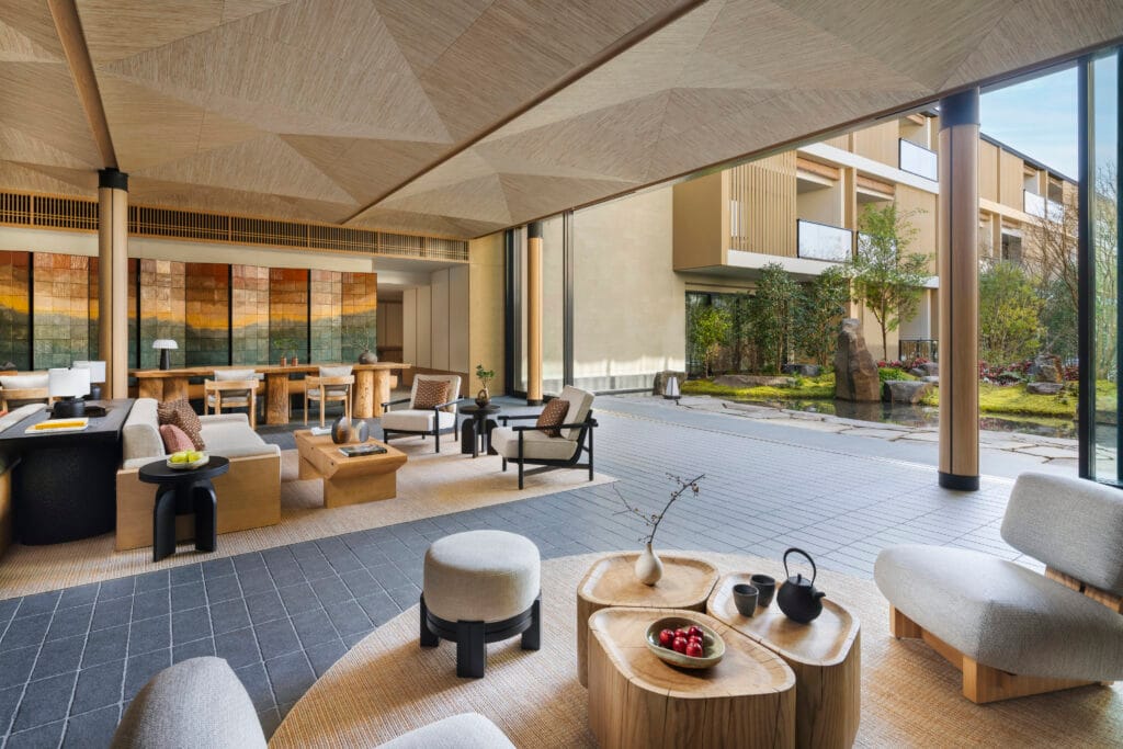 Lobby lounge with natural wood furnishings at Six Senses Kyoto in Higashiyama