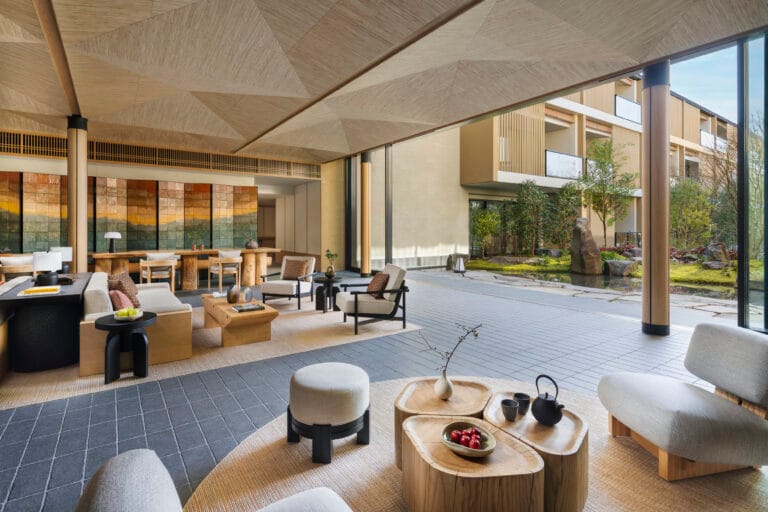 Lobby lounge with natural wood furnishings at Six Senses Kyoto in Higashiyama