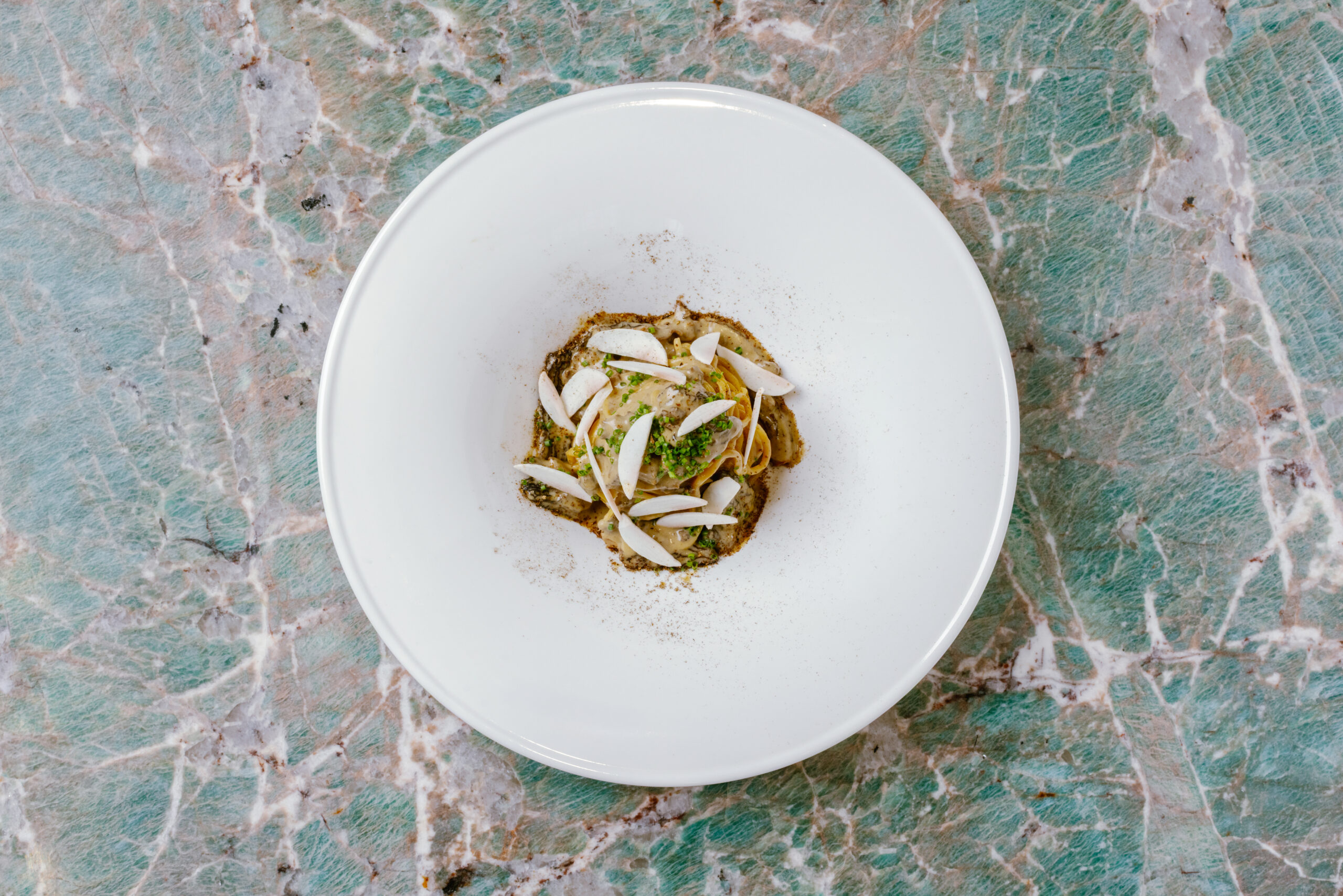 Homemade egg tagliolini with mushrooms at Tiffany Blue Box Café